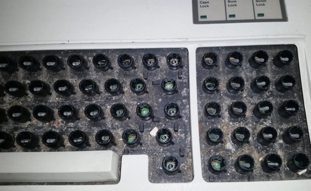 Example of an original – dirty – Model F typically found on eBay. You can’t see the gunk in the listing photos as it is hidden under the keys.