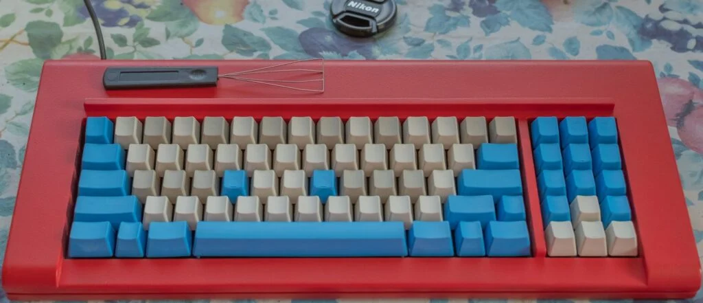 Brand New Model F August Update – keyboards continue shipping, new Beam Spring project launch, and more! 15 Below is another photo shared with permission. This one shows the classic style zinc True Red F77 case with pearl/pebble keys as well as Industrial SSK blue keys, and with pebble keys making up part of the home row and top row.