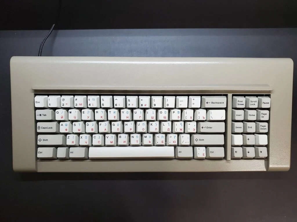 The factory can even do green, red, and blue for the sublimation text/graphics and multiple colors can be printed at the same time and on the same keycap, as shown in the three Russian-Hebrew-English photos below. If anyone wants one-off sets in various colors it is possible, though some sublimation colors come out better than others and you’d have to make them to find out. So far green, blue, and red have come out nicely.