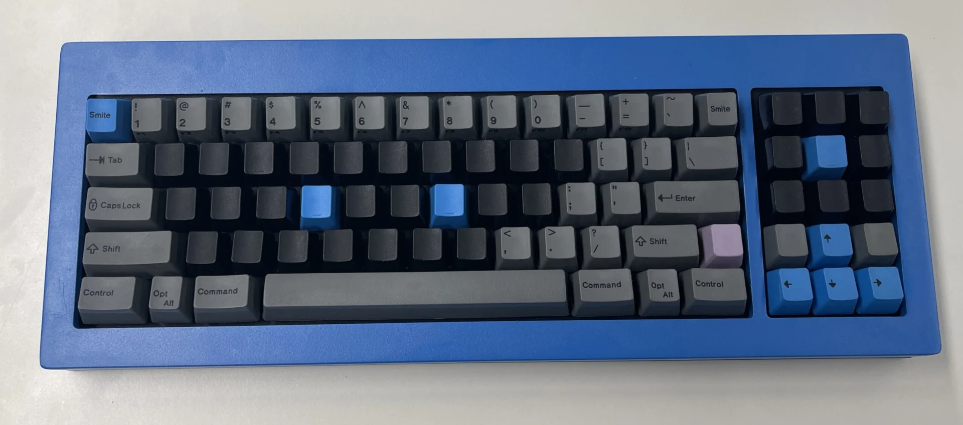 Brand New Model F February 2024 Update: in the media, final sale, production status, article from the Model F inventor, firmware updates, customer images, and more! 15 Posting (with permission) another nice setup: the compact F77 dark blue case with a customized key setup.