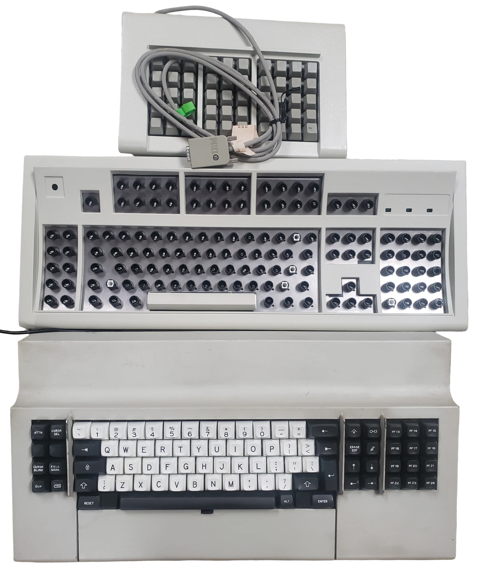 From top to bottom: Top photo: NOS IBM F50 (several are now available to buy at auction starting the day of this blog update post; see below for details), approved off-white/beige sample F122 case (sample inner assembly plate not painted), IBM original beam spring keyboard. Bottom photo: approved industrial gray sample case, NOS IBM Industrial Gray Model M case.