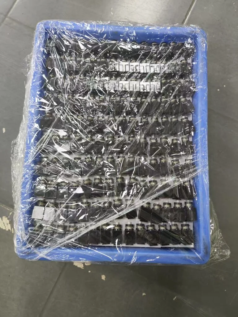 Here’s a photo showing how the modules are being stored while we wait for the other parts to be completed. The modules are on layers in trays, with a cardboard separation between each layer of modules.