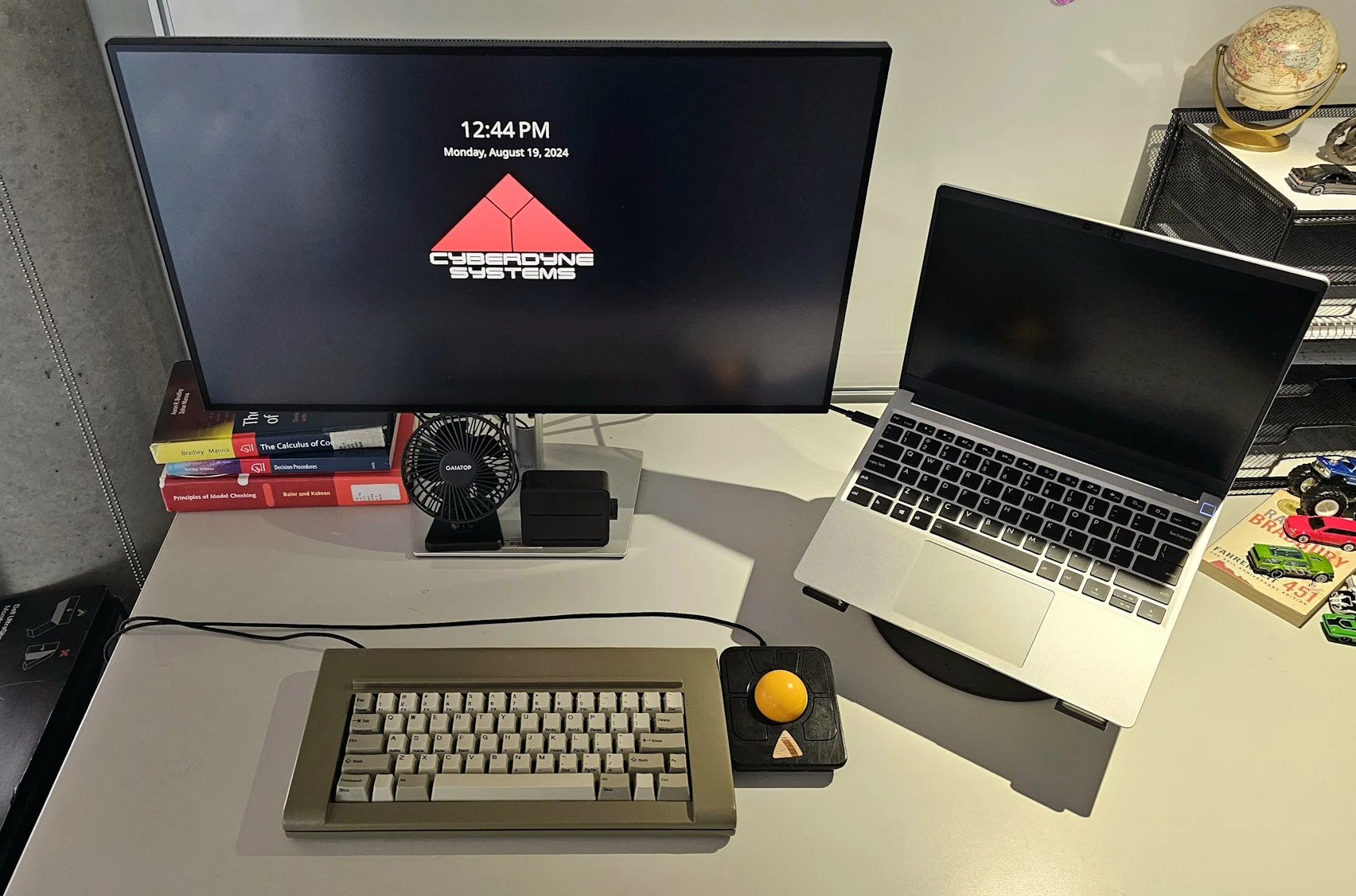 With permission I am sharing a nice setup with an Industrial Gray F62, the HHKB Front Print Key set, and a trackball: “the F62 and a Ploopy Adept, both running Vial, connected to a Framework 13 running Arch.”
