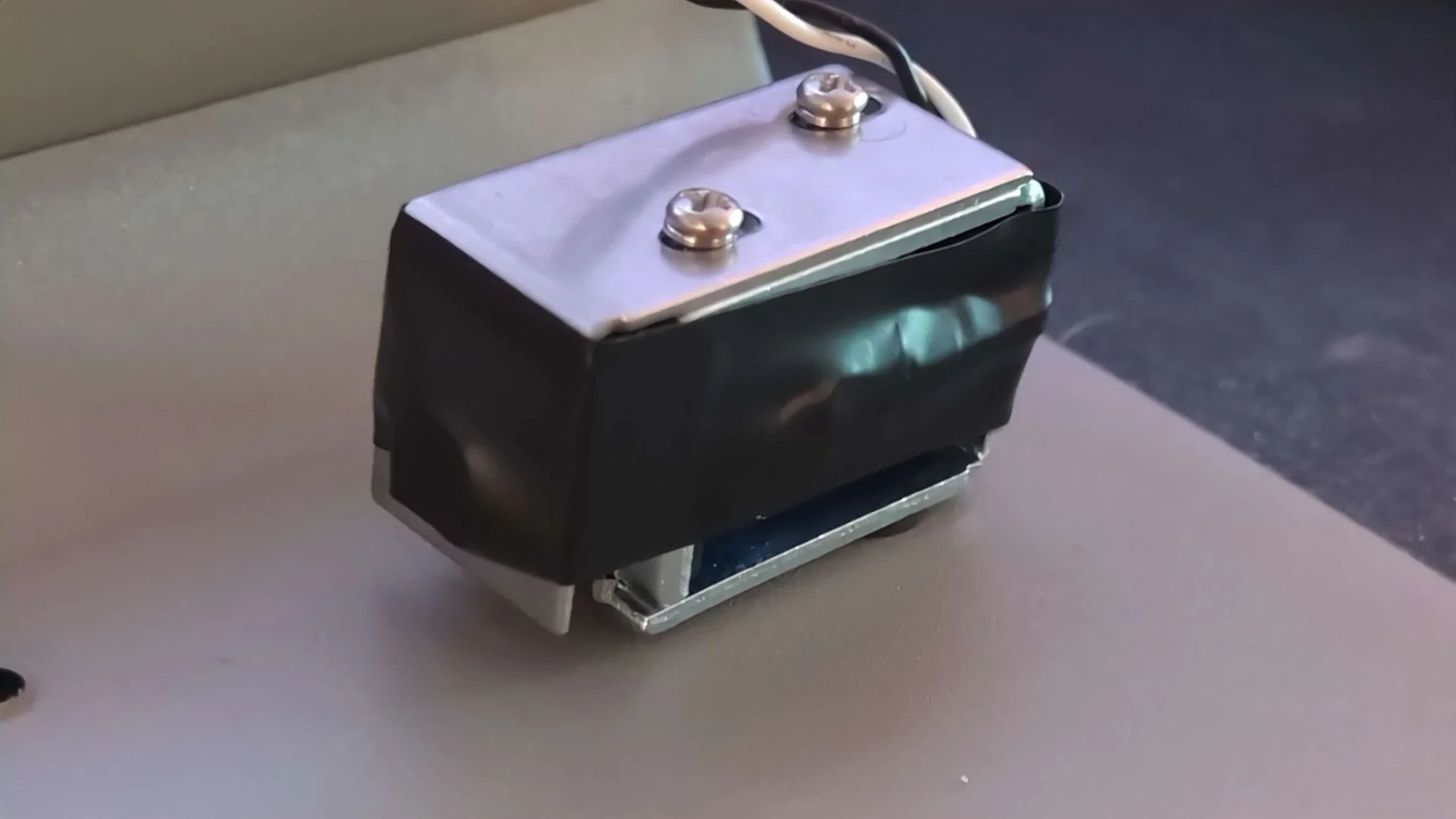 “I also restricted my solenoid a little bit further with some electrical tape. I applied it and stretched it a bit further out using the top bracket. I would say the sound without it has a bit of a harsh/high frequency impact — metal on metal kinda sound that reverberates through the backplate. Adding the tape sorta rounded it out, making it work much much better with the keys to my ears. Much more subtle and typewriter-y.”