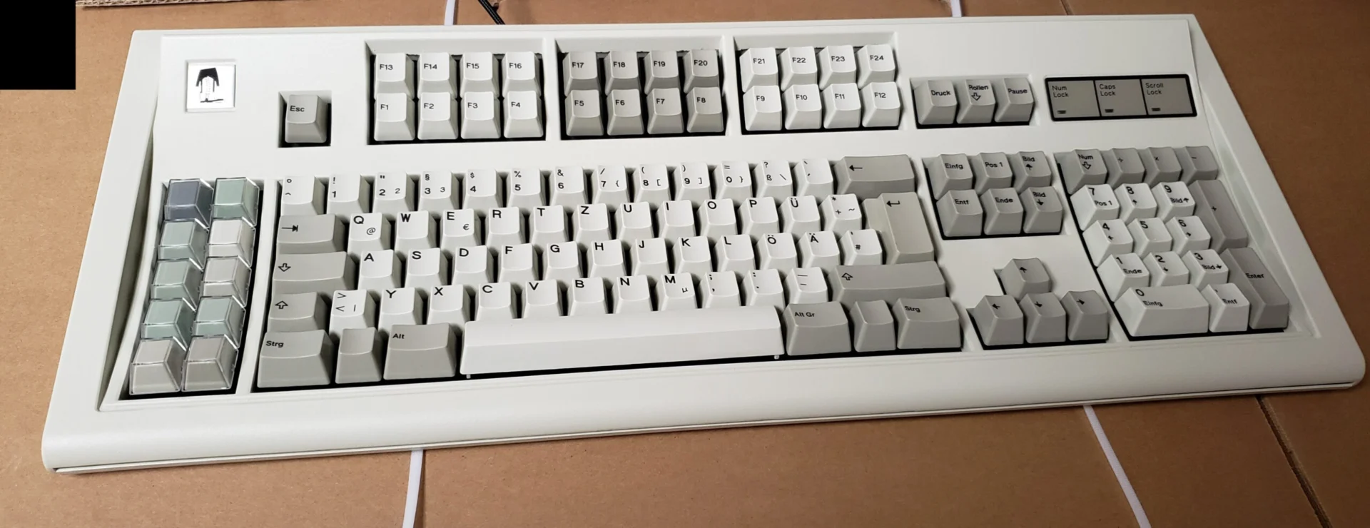 Also below is a photo of one of the aforementioned keyboards that I have been testing and optimizing firmware with; it will be going to a user of the German layout (pardon the cell phone quality)