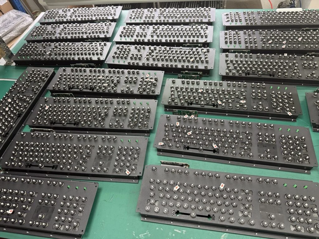 The first photo below shows part of the quality control inspection process. After assembly of the inner assembly, each key is tested with the signal level monitor tester of the Leyden Jar or xwhatsit utility and modules are identified for repair/replacement. The factory has also finalized the boxes and outside foam, now that we are getting close to finishing up. The design is back to the double-walled box design of the earlier rounds. Below is the B104 prototype box that was approved in August.